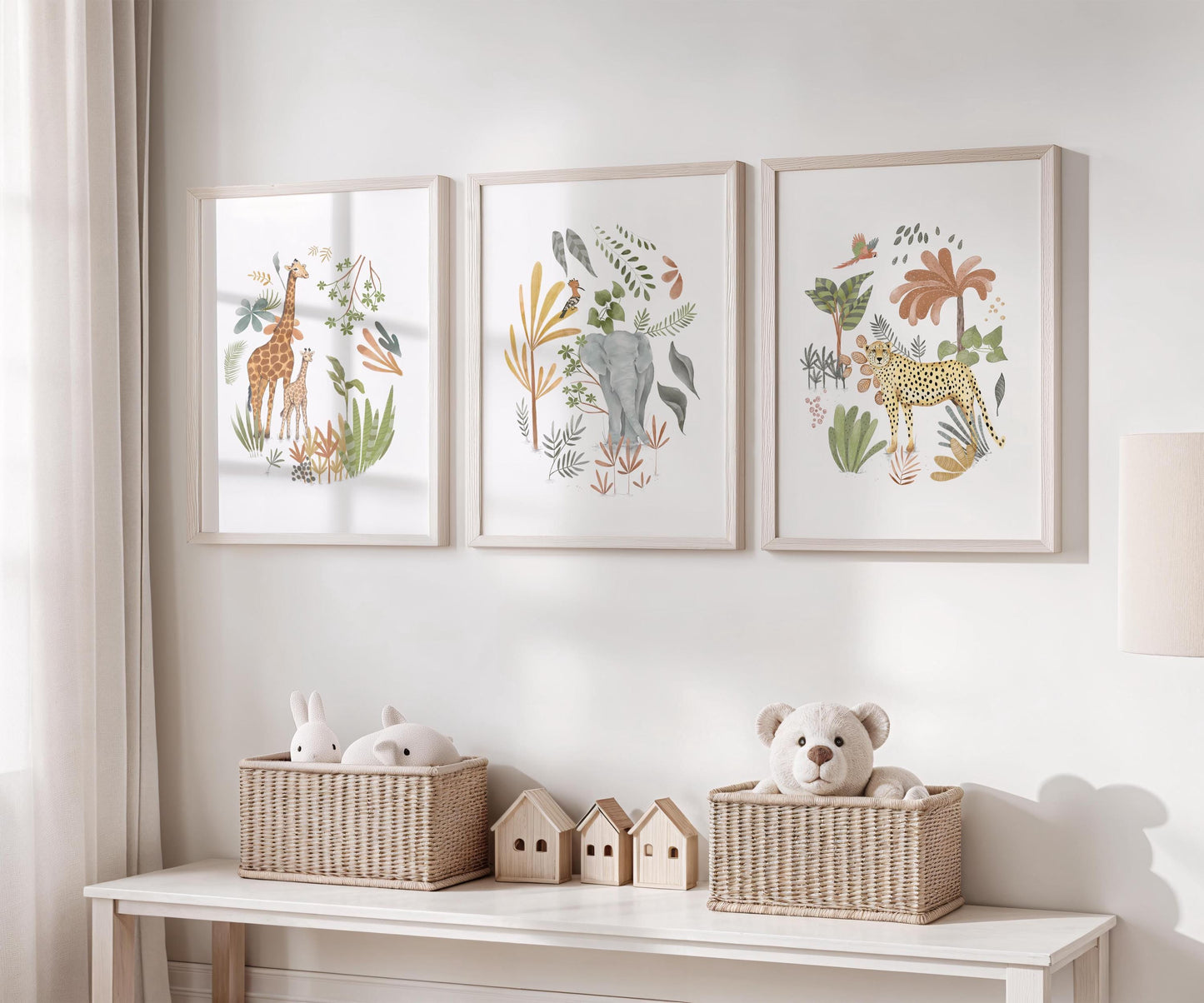 a white shelf with three framed animal prints and two wicker baskets containing stuffed animals.