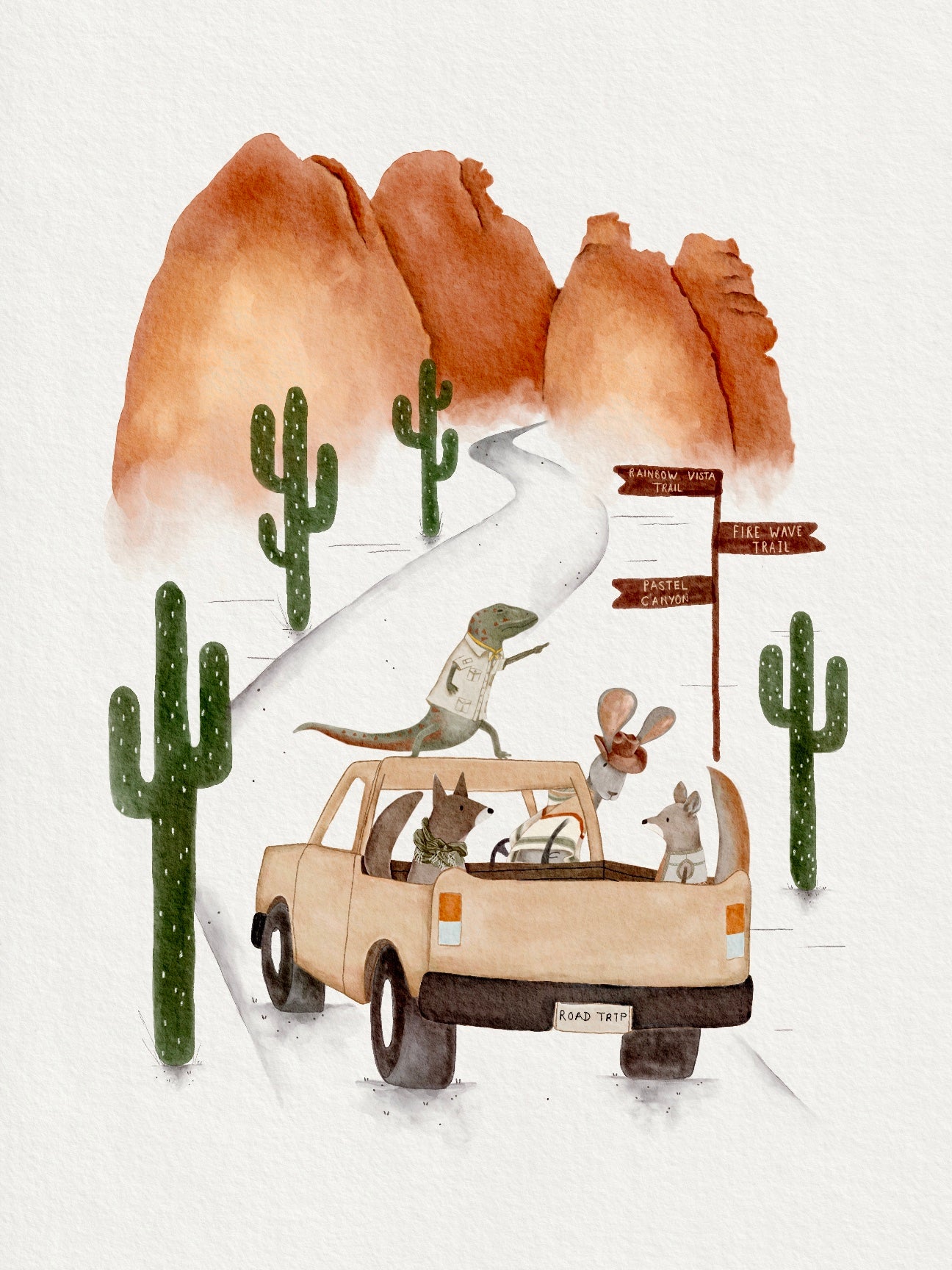 Whimsical watercolor illustration of desert animals on a road trip. A lizard, coyote, mouse, and kangaroo ride in a tan pickup truck through a desert landscape with tall cacti and red rock formations. Wooden trail signs point to Rainbow Vista Trail, Fire Wave Trail, and Pastel Canyon under a bright, clear sky.