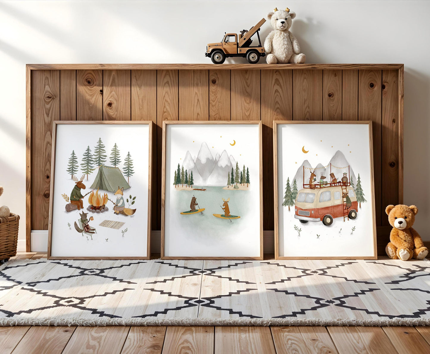 three framed pictures of camping scenes, including a tent, a campfire, and people enjoying the outdoors.